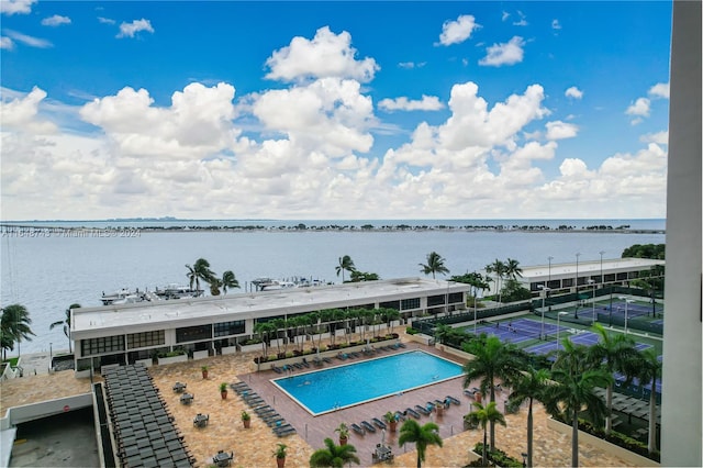 view of pool with a water view