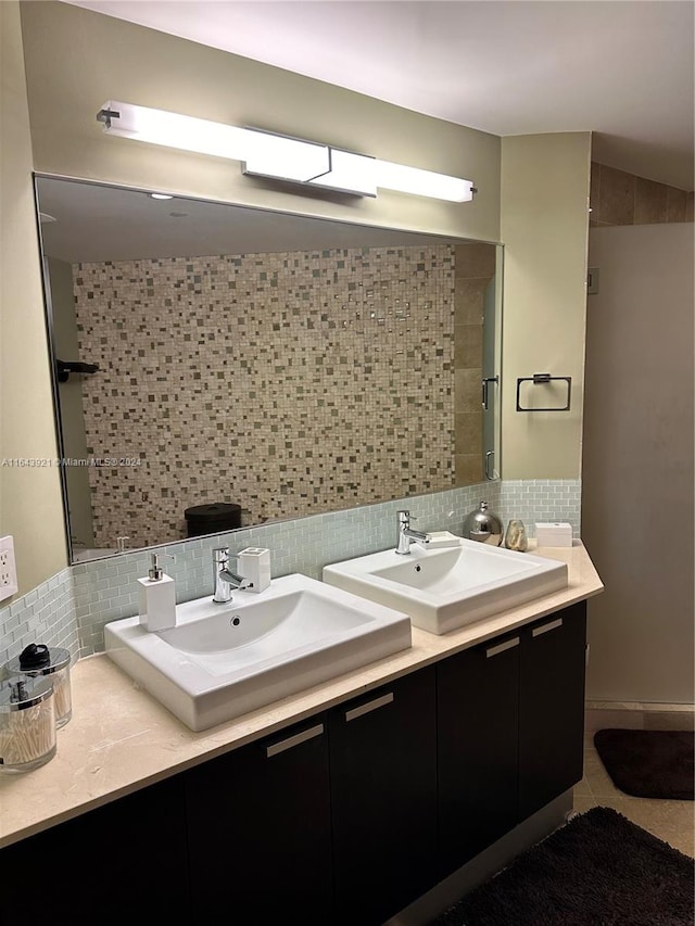 bathroom with backsplash, vanity, and tile patterned floors