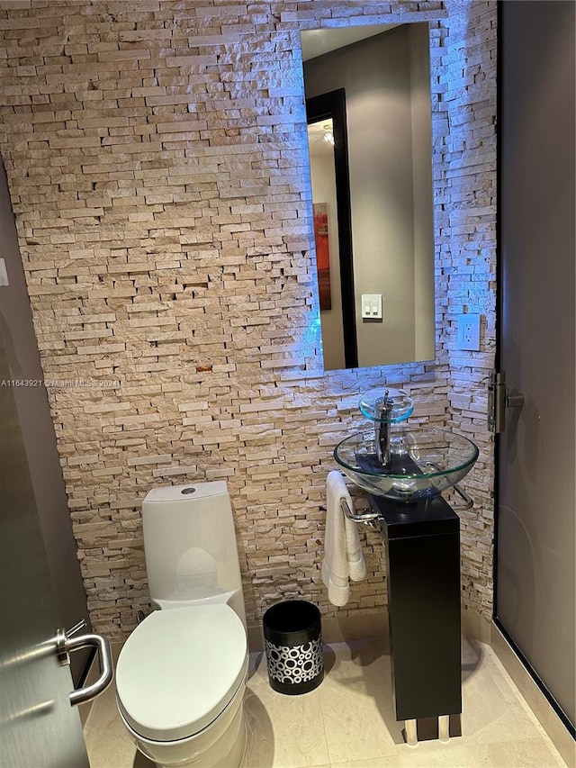 bathroom with vanity, toilet, and tile patterned floors