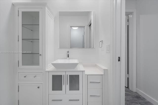 150 SE 3rd Ave, Dania Beach, FL 33004 - bathroom with vanity and baseboards