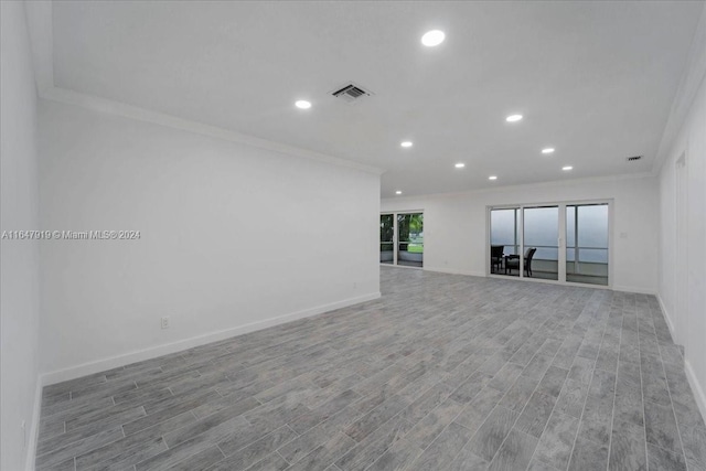 150 SE 3rd Ave, Dania Beach, FL 33004 - unfurnished room featuring ornamental molding, wood finished floors, and recessed lighting
