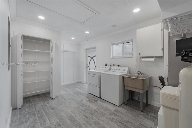 150 SE 3rd Ave, Dania Beach, FL 33004 - washroom featuring attic access, washing machine and dryer, light wood finished floors, recessed lighting, and crown molding