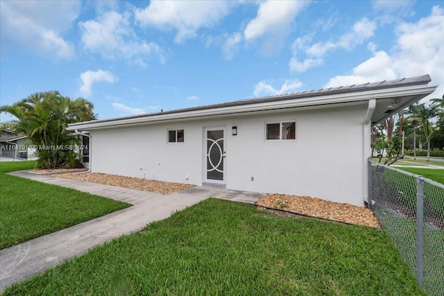 150 SE 3rd Ave, Dania Beach, FL 33004 - back of house with stucco siding