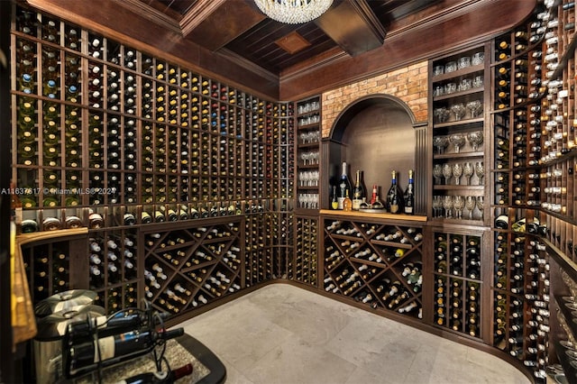 wine area featuring tile patterned flooring and coffered ceiling