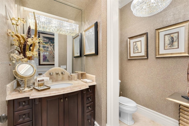 bathroom with tile patterned flooring, vanity, and toilet