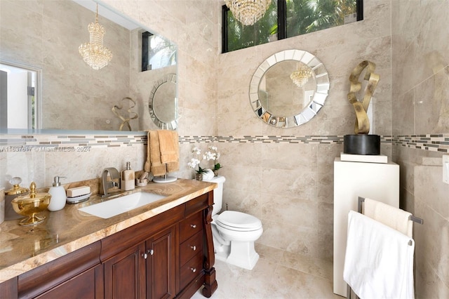 bathroom featuring vanity, toilet, tile patterned flooring, and tile walls