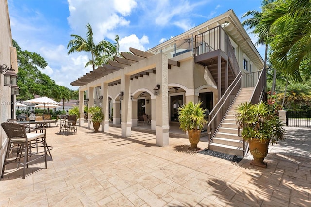 rear view of property featuring a patio area