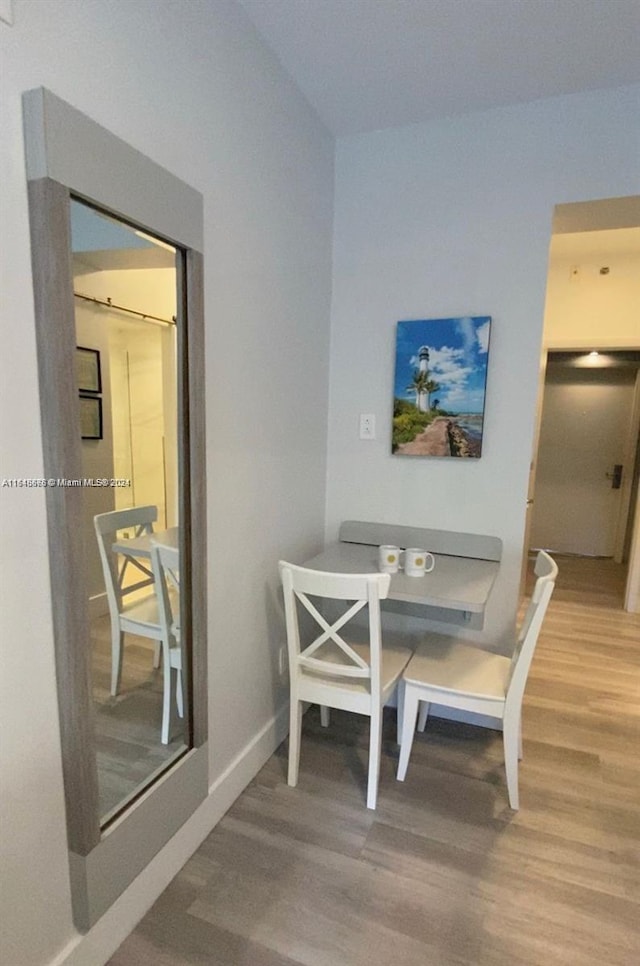 dining room with hardwood / wood-style flooring