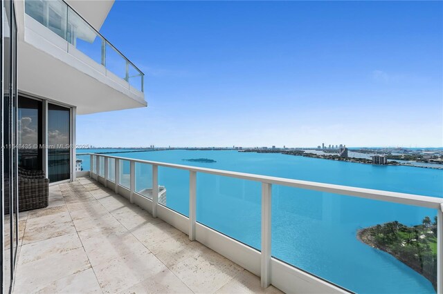 balcony featuring a water view