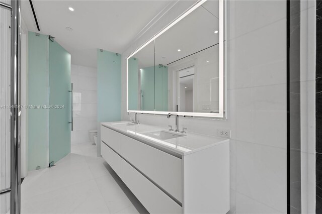 300 Biscayne Blvd Way Unit 4604, Miami, FL 33131 - full bathroom featuring toilet, double vanity, and tile patterned flooring