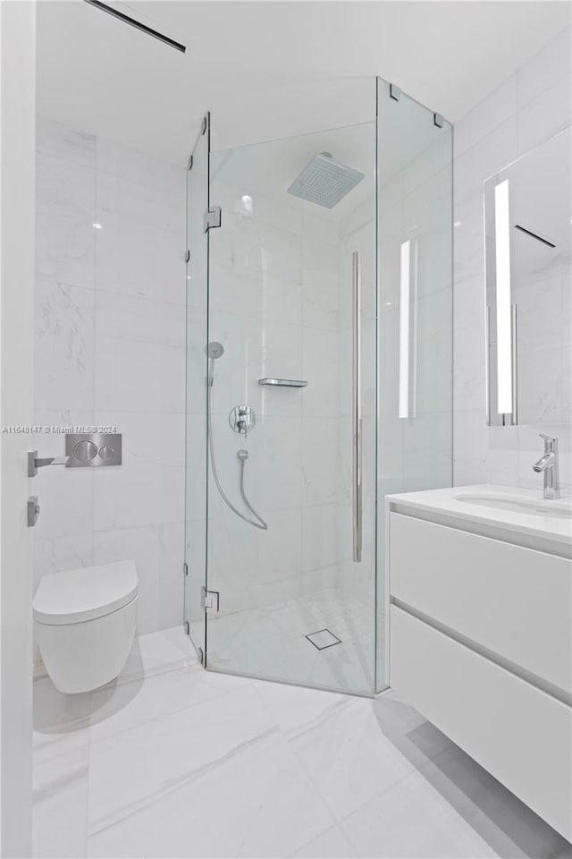 bathroom with vanity, an enclosed shower, tile patterned flooring, tile walls, and toilet