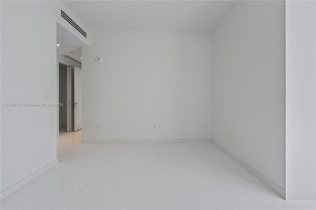 spare room featuring light tile patterned floors