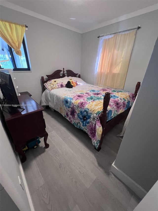940 NW 34th Ave, Lauderhill, FL 33311 - bedroom with wood finished floors and crown molding