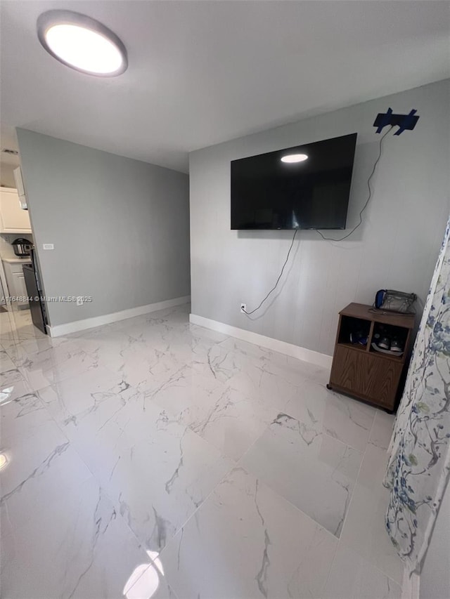 940 NW 34th Ave, Lauderhill, FL 33311 - unfurnished living room featuring baseboards and light marble finish floors