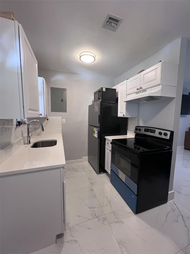 940 NW 34th Ave, Lauderhill, FL 33311 - kitchen with stainless steel range with electric cooktop, electric panel, light marble finish floors, and a sink