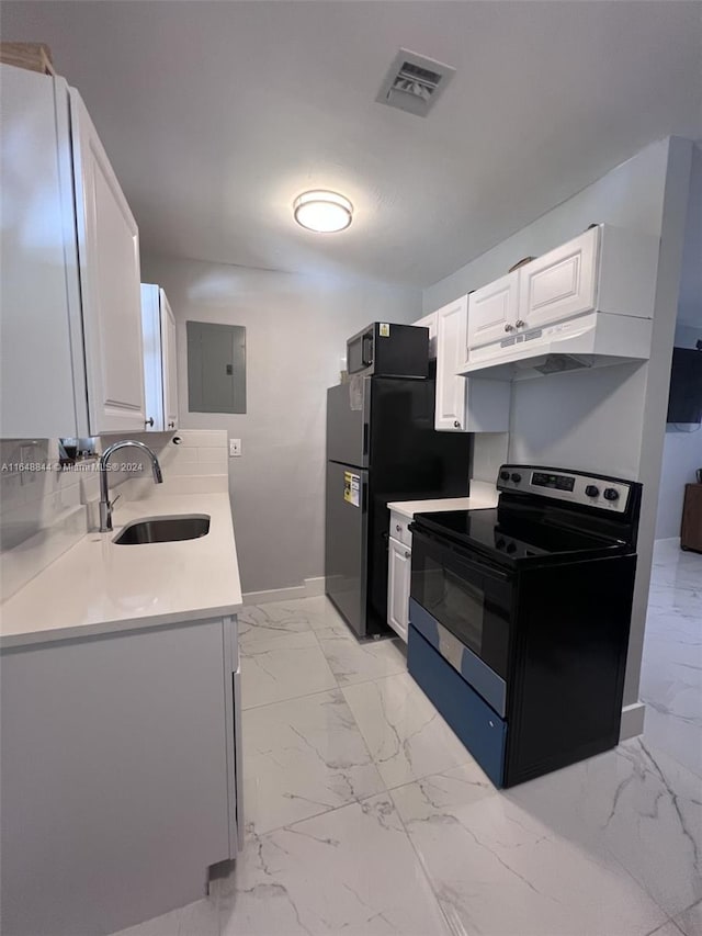 kitchen with electric panel, black appliances, sink, and white cabinetry