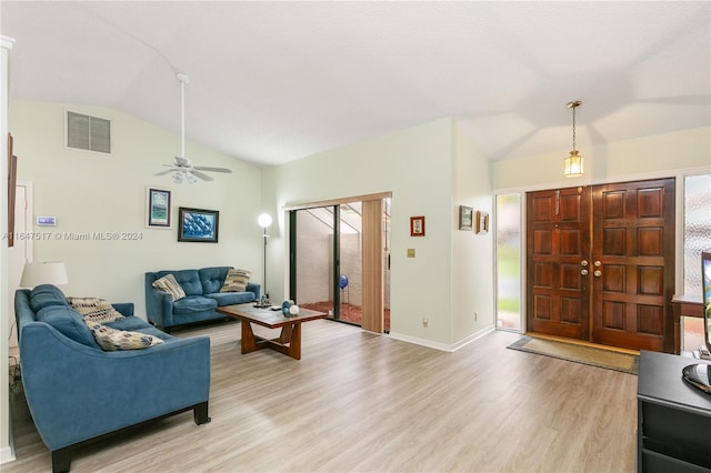 living room with ceiling fan, plenty of natural light, light hardwood / wood-style flooring, and lofted ceiling