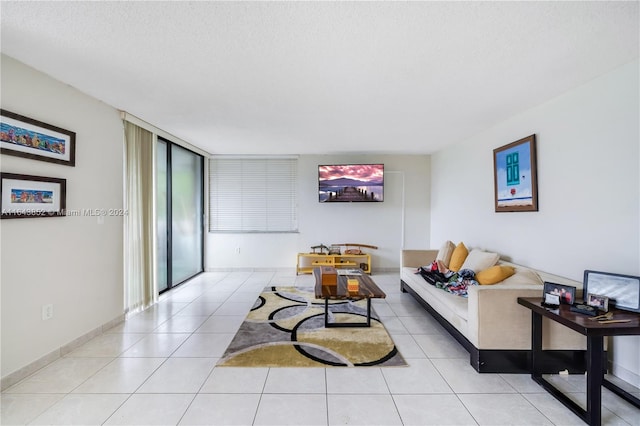 tiled living room with a textured ceiling