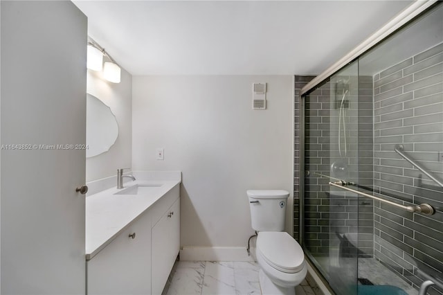 bathroom featuring tile patterned flooring, vanity, walk in shower, and toilet