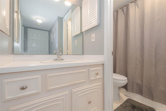 bathroom featuring hardwood / wood-style flooring, toilet, walk in shower, and vanity