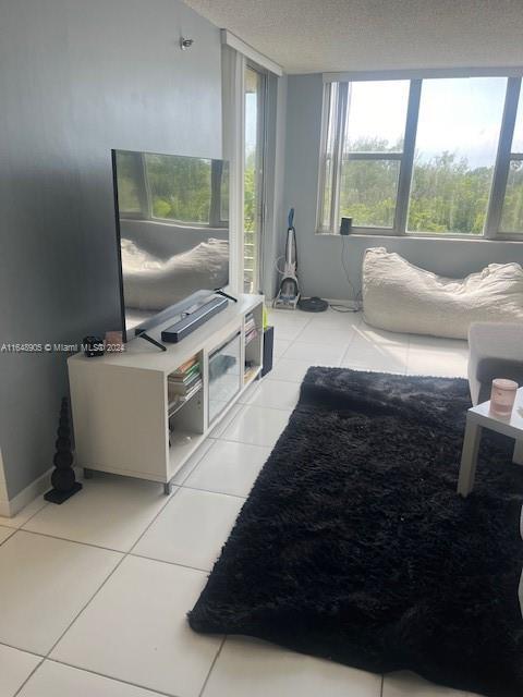 living room with light tile patterned floors