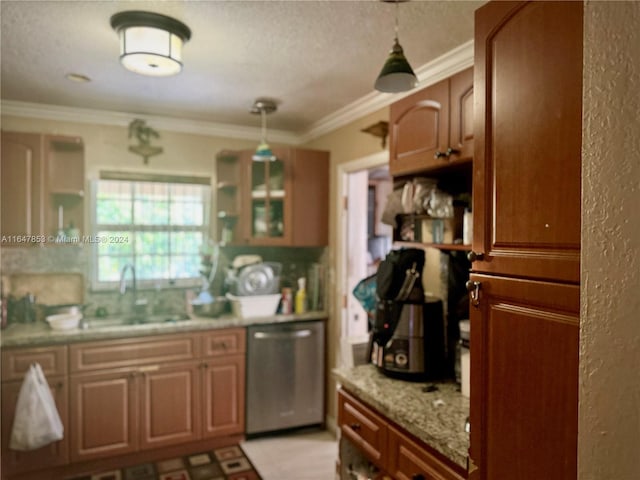 kitchen featuring stainless steel dishwasher, sink, ornamental molding, and decorative light fixtures