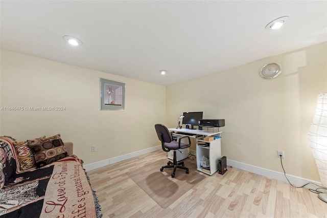 office space with light wood-type flooring