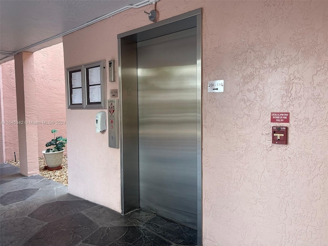 doorway to property with elevator