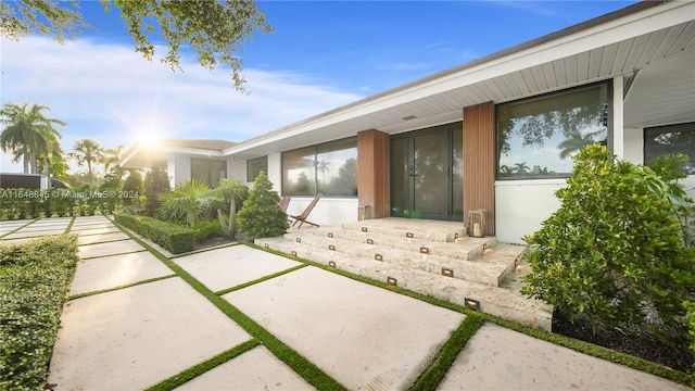 doorway to property featuring a patio