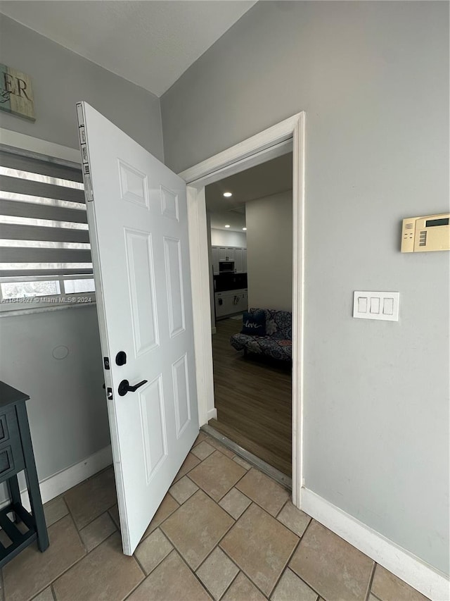 corridor featuring light hardwood / wood-style floors