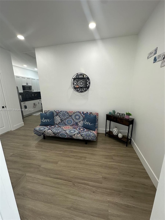 sitting room featuring wood-type flooring