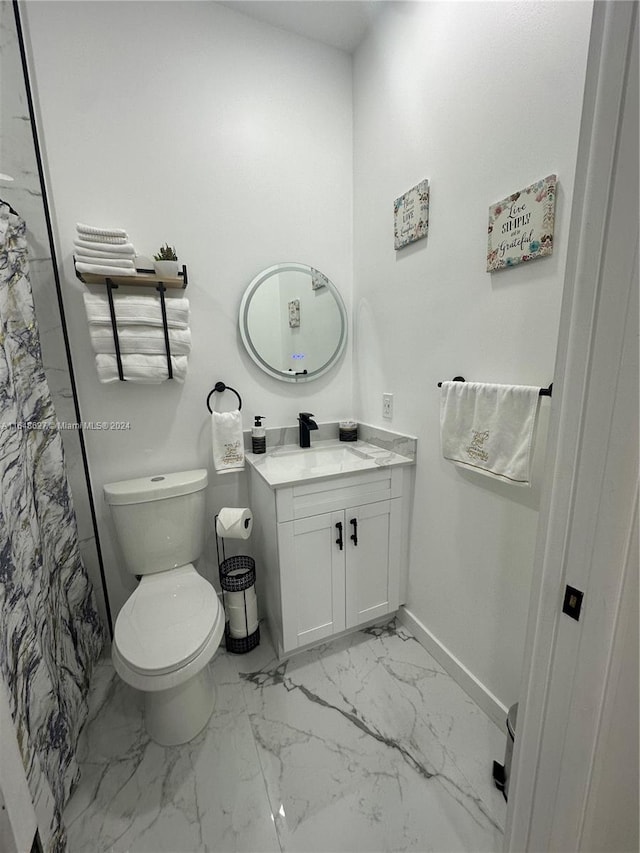 bathroom with vanity, toilet, and a shower with curtain