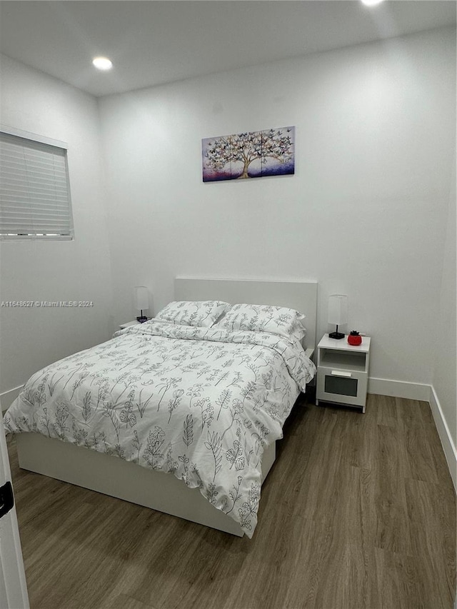 bedroom featuring hardwood / wood-style flooring