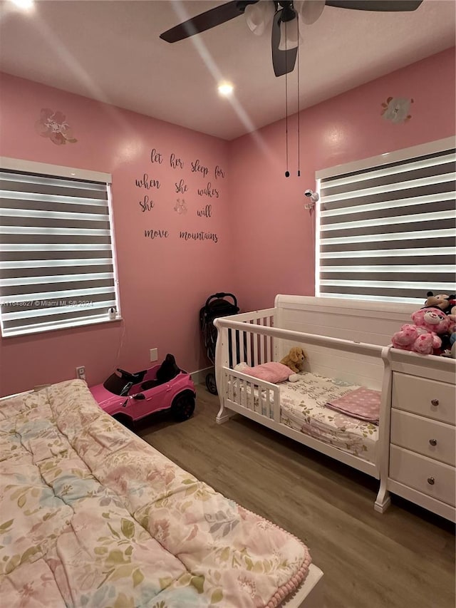 bedroom featuring ceiling fan and hardwood / wood-style flooring