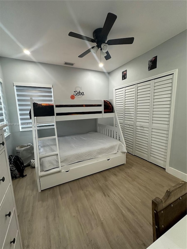 bedroom featuring light wood-type flooring and ceiling fan