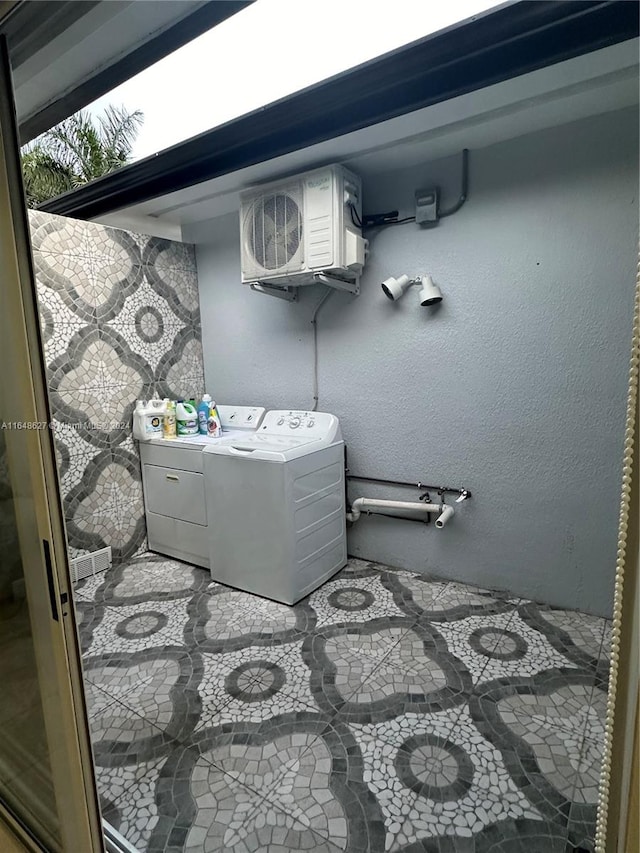 bathroom with washing machine and clothes dryer and vanity