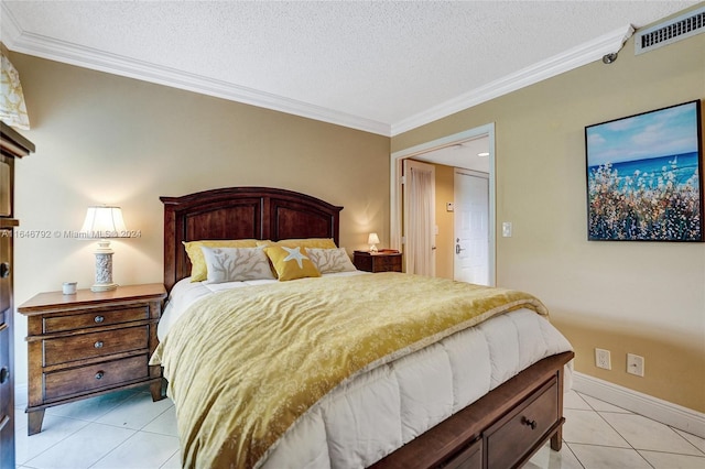 bedroom with ornamental molding, a textured ceiling, and light tile patterned floors