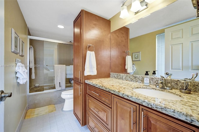 full bathroom featuring tiled shower / bath, vanity, toilet, and tile patterned flooring