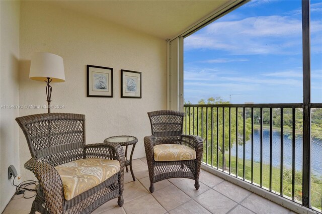 balcony featuring a water view