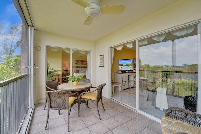 sunroom / solarium with ceiling fan