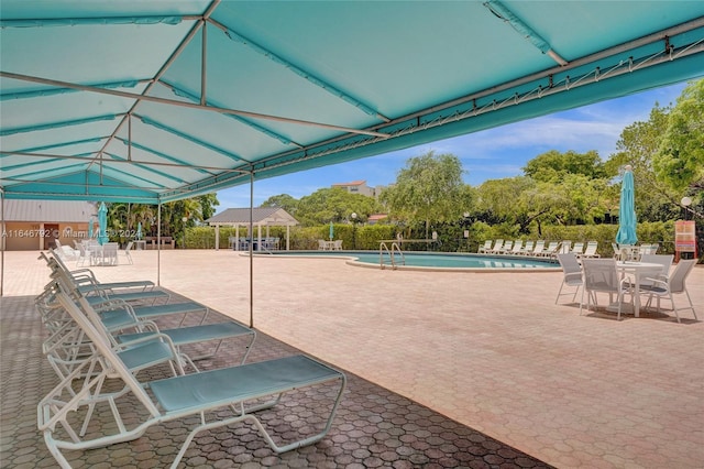 view of pool featuring a patio area and a gazebo