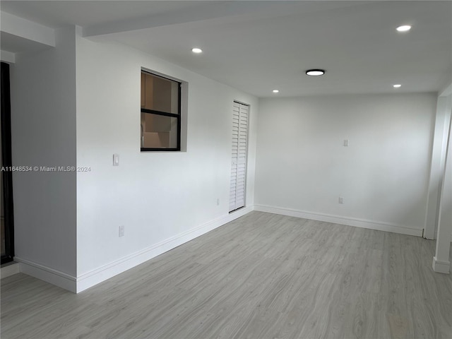 empty room with light wood-type flooring