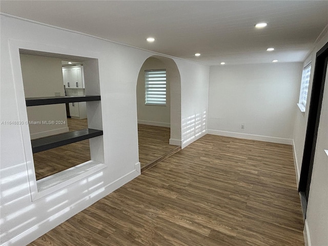 spare room featuring wood-type flooring