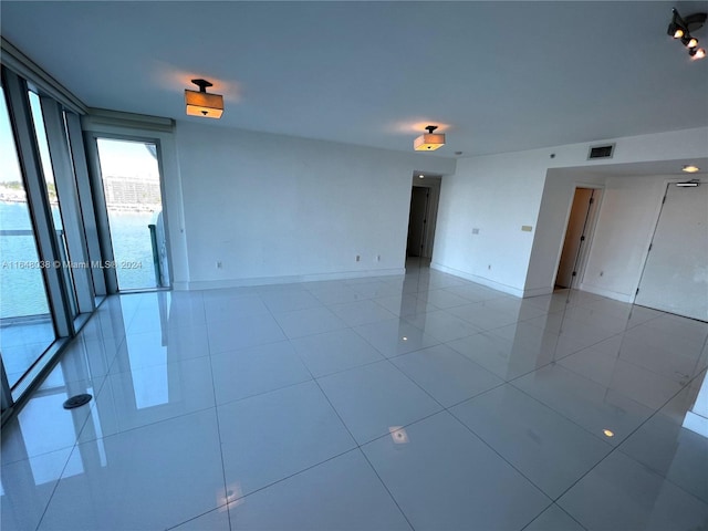 spare room with light tile patterned floors