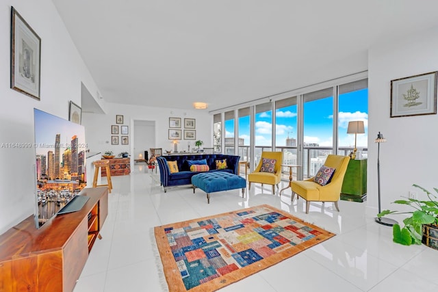 living room featuring light tile patterned flooring and expansive windows