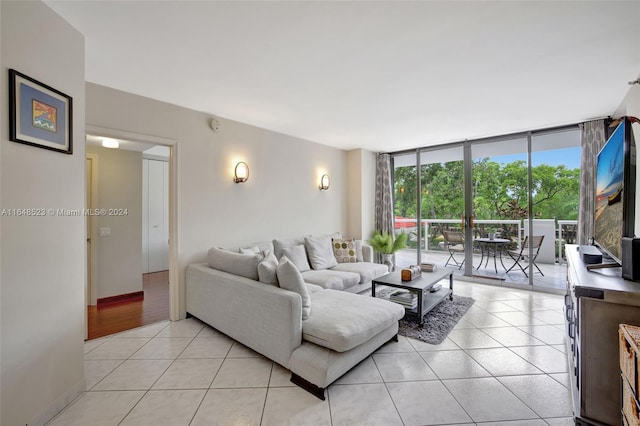 living room featuring light hardwood / wood-style flooring and floor to ceiling windows