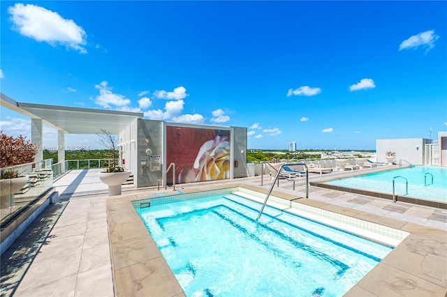 view of pool featuring a patio area