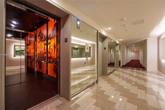 hallway featuring elevator