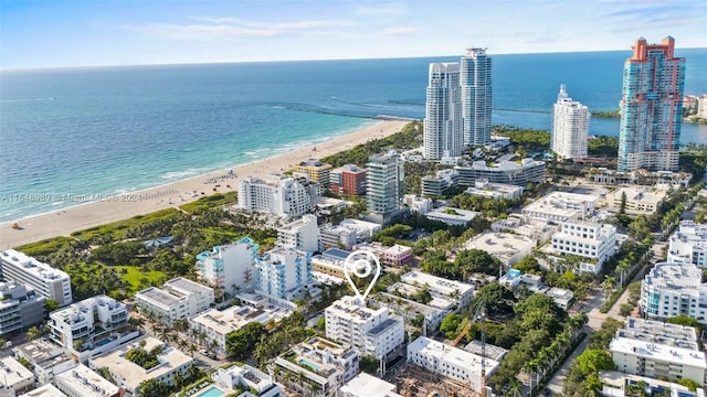 bird's eye view with a water view and a view of the beach