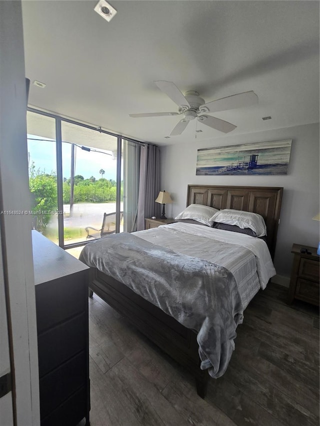 bedroom featuring access to outside, dark wood finished floors, and ceiling fan